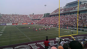 Outdoor college football game.