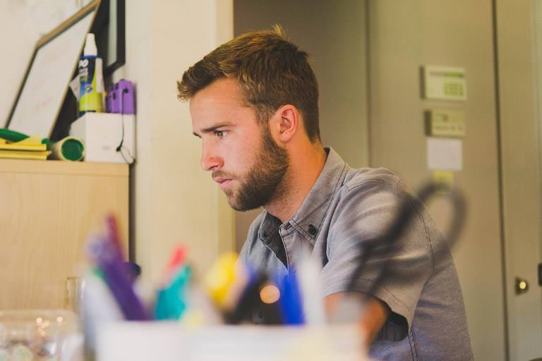 Man working at a desk.